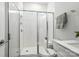 Modern bathroom with tiled shower, glass door, and white fixtures at 2024 Cedar Falls Dr # 9, Waxhaw, NC 28173