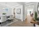 Elegant dining room featuring hardwood floors, modern decor, and bright, airy lighting at 2024 Cedar Falls Dr # 9, Waxhaw, NC 28173