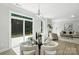 Bright dining room with modern light fixture and sliding door to outdoor living at 2024 Cedar Falls Dr # 9, Waxhaw, NC 28173
