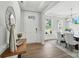 Bright and welcoming foyer with light hardwood floors, a modern light fixture, and white accents at 2024 Cedar Falls Dr # 9, Waxhaw, NC 28173