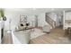 A bright living room includes a cozy fireplace and access to an upstairs staircase at 2024 Cedar Falls Dr # 9, Waxhaw, NC 28173