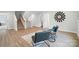 Open living area with wood floors, modern furniture, stairs, and ample space at 2024 Cedar Falls Dr # 9, Waxhaw, NC 28173