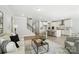 Open concept living space, kitchen, island, living room, and staircase at 2024 Cedar Falls Dr # 9, Waxhaw, NC 28173