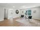 Comfortable sitting room with hardwood floors, stylish furniture, and abundant natural light at 2024 Cedar Falls Dr # 9, Waxhaw, NC 28173