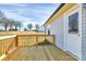 Back deck has a white door, vinyl siding and green grass at 6187 Long Branch Rd, Salisbury, NC 28147