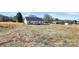 Backyard view shows light blue siding and a cozy wood deck, creating a peaceful outdoor setting at 6187 Long Branch Rd, Salisbury, NC 28147