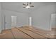 A bedroom with white walls and trim offers a clean, modern aesthetic at 6187 Long Branch Rd, Salisbury, NC 28147