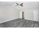 Spacious bedroom features modern ceiling fan and grey wood-look flooring at 6187 Long Branch Rd, Salisbury, NC 28147