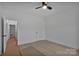 Spacious bedroom with modern ceiling fan and light, freshly painted walls at 6187 Long Branch Rd, Salisbury, NC 28147