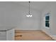 Cozy dining area with a modern chandelier, white walls, and a window for natural light, perfect for Gathering meals at 6187 Long Branch Rd, Salisbury, NC 28147