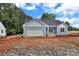 Charming single-story home features blue siding, a two-car garage, and classic design at 6187 Long Branch Rd, Salisbury, NC 28147