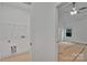 Well-lit hallway connecting laundry area and bedroom, offering convenience and access to essential home functions at 6187 Long Branch Rd, Salisbury, NC 28147