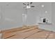 Bright living space with white walls, fan, and open layout flowing into the kitchen, ready for personalization at 6187 Long Branch Rd, Salisbury, NC 28147
