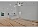 Expansive living room with bright white walls and a ceiling fan, awaiting its final touches for a modern feel at 6187 Long Branch Rd, Salisbury, NC 28147