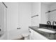 Bathroom featuring a granite countertop, black fixtures, white vanity, and white toilet at 6201 Long Branch Rd, Salisbury, NC 28147