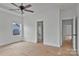 Bright bedroom featuring neutral walls, a window view, and access to en-suite bathroom and hallway at 6201 Long Branch Rd, Salisbury, NC 28147