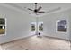 Light-filled bedroom with three windows, ceiling fan, and a spacious, airy feel perfect for relaxation at 6201 Long Branch Rd, Salisbury, NC 28147