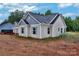 Exterior view of a gray and white home with light blue shutters at 6201 Long Branch Rd, Salisbury, NC 28147