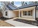 Inviting front entry with covered porch, fresh mulch and new landscaping at 6201 Long Branch Rd, Salisbury, NC 28147