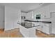 Well-appointed kitchen boasts granite countertops, white cabinetry, and a central island perfect for meal preparation and casual dining at 6201 Long Branch Rd, Salisbury, NC 28147