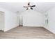 Minimalist living room with vaulted ceilings, a ceiling fan, and wood-look flooring at 6201 Long Branch Rd, Salisbury, NC 28147