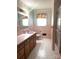 Vintage pink bathroom featuring a unique hexagon tile floor and a walk-in shower at 2310 Montford Nw Ave, Concord, NC 28027