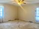 Bright bedroom featuring neutral walls, ceiling fan, and natural light from the window at 2310 Montford Nw Ave, Concord, NC 28027