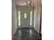 Welcoming foyer with a decorative door with sidelights and slate tile flooring at 2310 Montford Nw Ave, Concord, NC 28027