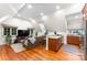 Open living area with hardwood floors and a kitchenette at 4536 Fox Brook Ln, Charlotte, NC 28211