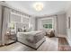 Serene bedroom with plush bed and window seating at 4536 Fox Brook Ln, Charlotte, NC 28211