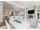 Open concept dining area with kitchen views and a modern chandelier at 4536 Fox Brook Ln, Charlotte, NC 28211