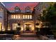 Elegant home entrance with stone facade and landscaping at 4536 Fox Brook Ln, Charlotte, NC 28211
