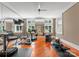 Bright home gym is equipped with various exercise machines and offers plenty of space for a workout at 4536 Fox Brook Ln, Charlotte, NC 28211