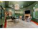 Elegant home office boasts built-in shelves and a large desk, bathed in natural light from expansive windows at 4536 Fox Brook Ln, Charlotte, NC 28211