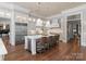 Bright kitchen boasts a large island, stainless steel appliances, and hardwood floors at 4536 Fox Brook Ln, Charlotte, NC 28211