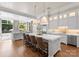 Spacious kitchen with island, stainless steel appliances, and white cabinetry at 4536 Fox Brook Ln, Charlotte, NC 28211