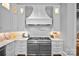 Modern kitchen with professional range and custom cabinetry at 4536 Fox Brook Ln, Charlotte, NC 28211