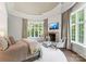 Large main bedroom with a fireplace, sitting area, and abundant natural light at 4536 Fox Brook Ln, Charlotte, NC 28211