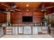Luxury outdoor kitchen with stainless steel appliances and granite countertops at 4536 Fox Brook Ln, Charlotte, NC 28211