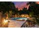 Inviting pool and spa with outdoor kitchen area at 4536 Fox Brook Ln, Charlotte, NC 28211