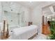 Relaxing spa room features a massage table and a large steam shower at 4536 Fox Brook Ln, Charlotte, NC 28211
