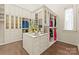 Large walk-in closet with custom built-ins and ample storage at 4536 Fox Brook Ln, Charlotte, NC 28211