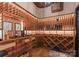 Well-equipped wine cellar with ample storage for bottles and glasses at 4536 Fox Brook Ln, Charlotte, NC 28211