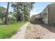 The exterior of this condominium features mature trees and private patios for residents to enjoy at 1600 Sharon W Rd # 11, Charlotte, NC 28210