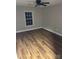 Cozy bedroom with modern flooring and window at 702 N 9Th St, Bessemer City, NC 28016