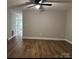 Open concept living room with modern flooring and neutral paint at 702 N 9Th St, Bessemer City, NC 28016