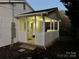 Back porch with white picket fence, covered porch, and view of the yard at 702 N 9Th St, Bessemer City, NC 28016