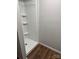 Modern white shower with built in shelving and a clean design at 702 N 9Th St, Bessemer City, NC 28016