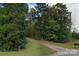 Wooded lot with a driveway entrance at 1451 York Rd, Kings Mountain, NC 28086