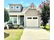 Charming home featuring a one-car garage and a well-manicured lawn, creating an inviting curb appeal at 916 Roxburgh Ave, Rock Hill, SC 29732